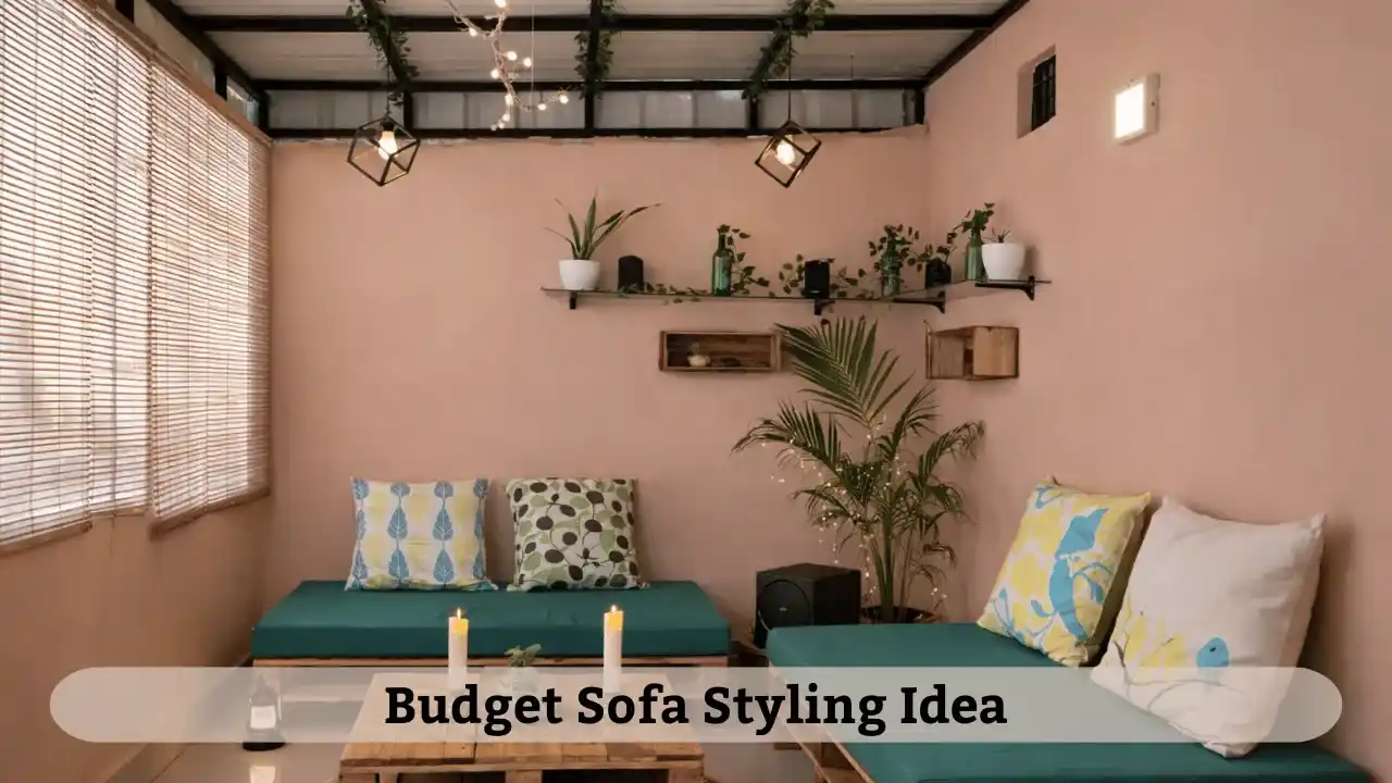 Budget friendly sofa styling with printed cushions and throw blanket for simple home decoration ideas in Indian living rooms.